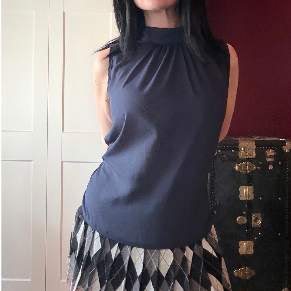navy blue high neck blouse with bow tie back